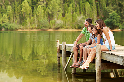 Buy stock photo Thinking, parents and smile with children on pier, exploring and bonding together on holiday. Space, people or relax on dock with kids, family connection and weekend break on vacation for sightseeing