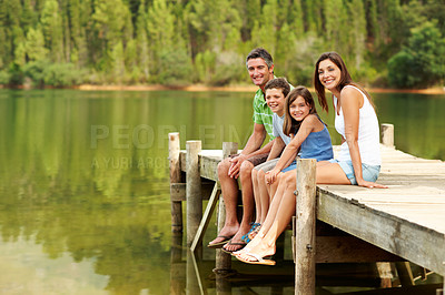 Buy stock photo Portrait, parents or smile with children at lake, relationship or bonding together on holiday. Space, people and relax on dock with kids, family connection or weekend break on vacation in countryside