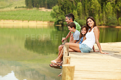 Buy stock photo Smile, parents or relax with children at lake, relationship or bonding together on holiday. Portrait, people or kids at water with space, family connection or weekend break on vacation in countryside