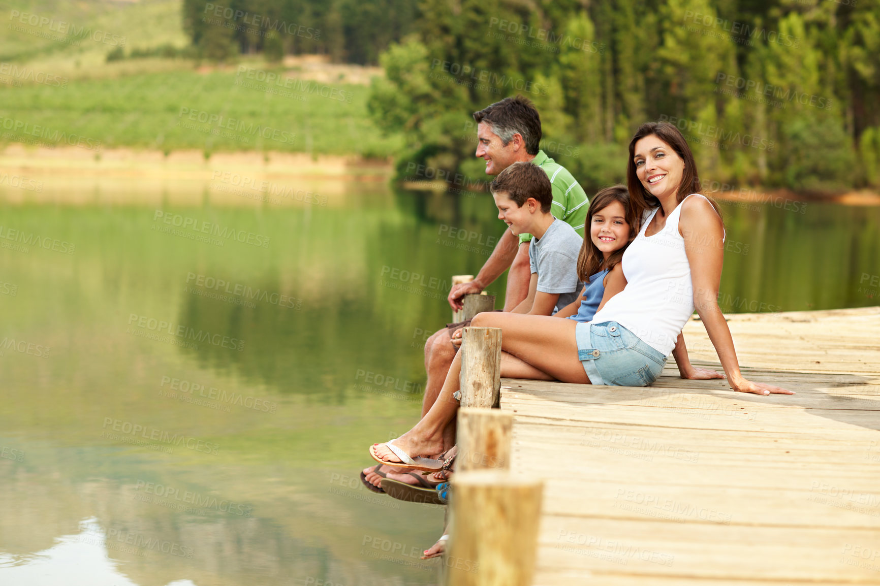 Buy stock photo Smile, parents or relax with children at lake, relationship or bonding together on holiday. Portrait, people or kids at water with space, family connection or weekend break on vacation in countryside