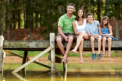 Buy stock photo Holiday, parents or children on deck with portrait, bonding together or connection on summer vacation. Smile, hug or family at lake with love, happy moment or healthy relationship on outdoor trip.