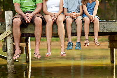 Buy stock photo Family, legs and dock by lake for vacation with countryside, bonding and relax in nature together. Parents, children and break with jetty outdoor for holiday, summer trip and travel in forest