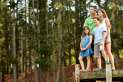 Buy stock photo Sightseeing, family and bonding with children in nature, mom and dad with space on vacation or trip. Outdoor, happy man and woman with kids, portrait and adventure in forest and travel with parents