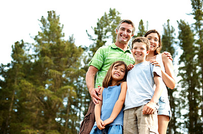 Buy stock photo Family, portrait and relax in woods for vacation with camping, bonding and smile in nature together. Mother, father and children with low angle space for holiday, summer trip or travel in countryside