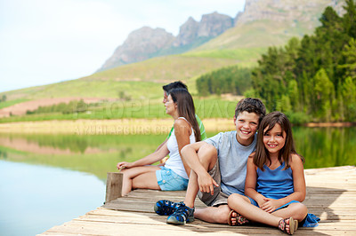 Buy stock photo Children, portrait and smile on dock for holiday with countryside, bonding and relax in nature together. Family, brother and sister with jetty outdoor for vacation, summer trip and travel by lake
