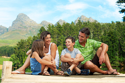 Buy stock photo Laugh, family and pier outdoor in countryside for summer holiday, vacation and together. Mountains, funny and connection of man, woman and children in nature to relax, bonding and care with love