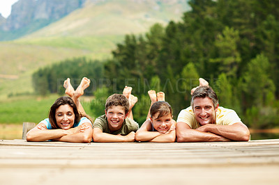 Buy stock photo Family, portrait and dock by lake for vacation with countryside, bonding and relax in nature together. Parents, children and break with jetty outdoor for holiday, summer trip and travel in forest