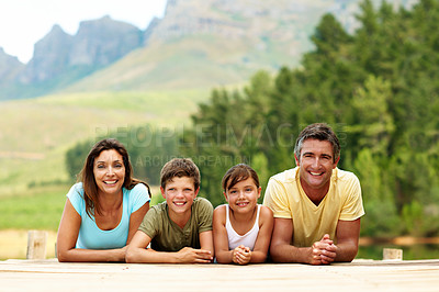 Buy stock photo Portrait, parents and smile with children on pier, adventure and bonding together on holiday. Happy, people and relax on dock with kids, family connection and weekend break on vacation in countryside