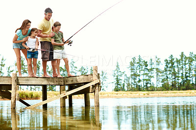 Buy stock photo Happy, parents and children by lake for fishing, summer vacation and bonding on weekend together. Family, space and pier with mom, dad and kids for adventure, activity and learning to catch fish
