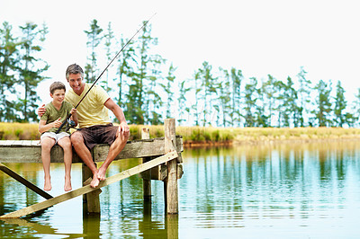Buy stock photo Dad, kid and fishing with hug on vacation together, teaching and happy with success at dock. Parent, boy and rod by water outdoor to relax, learning or embrace for good job on holiday with space