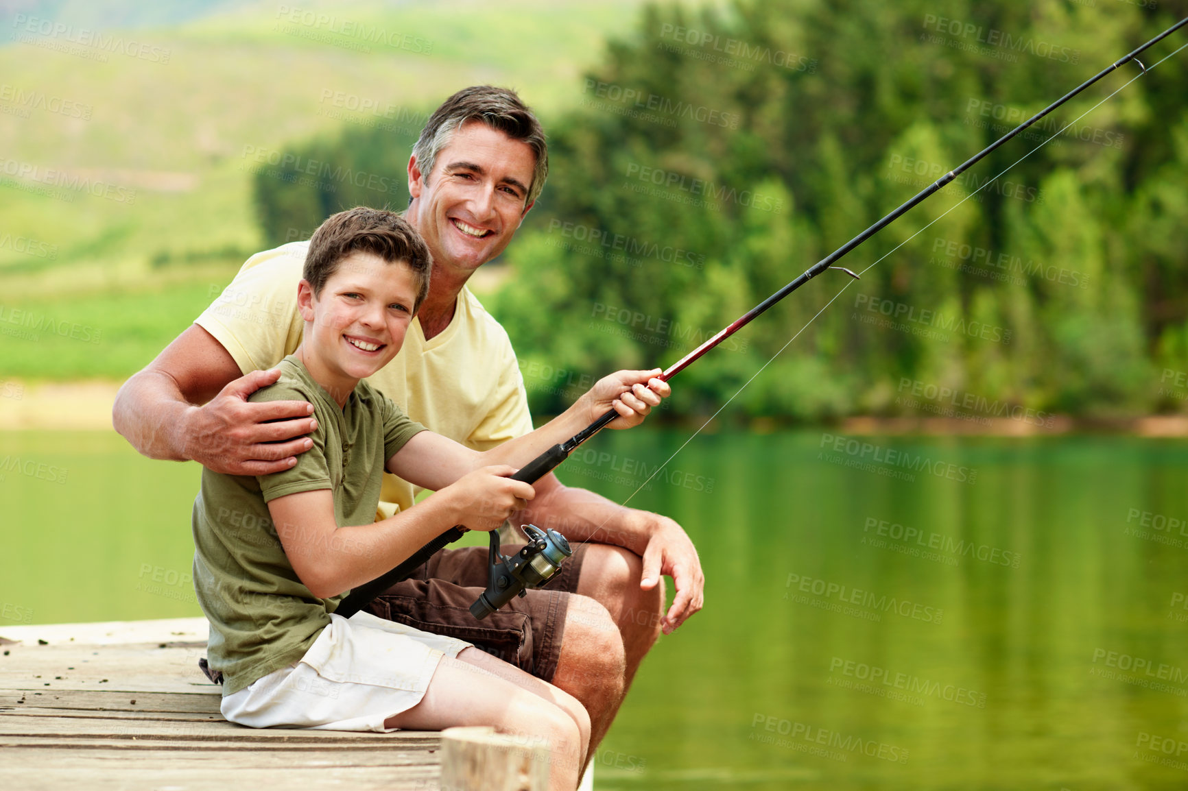 Buy stock photo Portrait, father and child at lake for fishing, adventure and teaching skills for casting technique. Smile, man and kid in nature with rod, family tradition and reel guidance for fisherman vacation