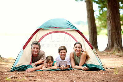 Buy stock photo Portrait, parents and kids with tent for camping, relax and bonding together for summer holiday. Happy family, mother and father outdoor at campsite with children, weekend or vacation for connection.