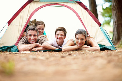 Buy stock photo Portrait, parents and kids at campsite with tent, weekend and bonding together for summer holiday. Space, mother and father camping outdoor in woods with children, happy family and tourist vacation.