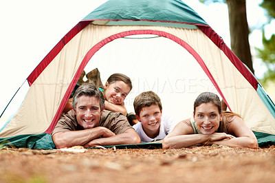 Buy stock photo Portrait, parents and children in nature with tent, camping and bonding together for summer vacation. Space, mother and father relax outdoor at campsite with kids, happy family and weekend holiday.