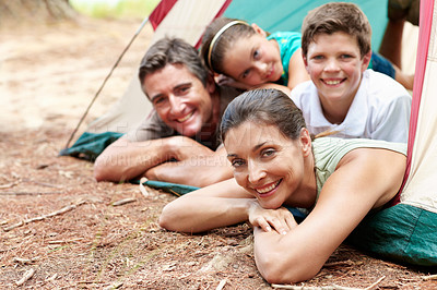 Buy stock photo Portrait, mother and kids in nature with tent, camping and bonding together for summer vacation. Happy, parents and father relax outdoor at campsite with children, family holiday and weekend break.