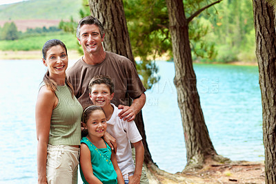 Buy stock photo Family, smile and portrait in forest for vacation with love, bonding and relax by lake together. Mother, father and children with people in woods for holiday, summer trip and travel in countryside