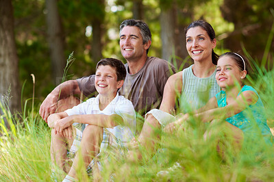 Buy stock photo Family, relax and smile in forest for holiday with love, bonding and sightseeing in nature together. Mother, father and children with break outdoor for vacation, summer trip and wilderness for travel