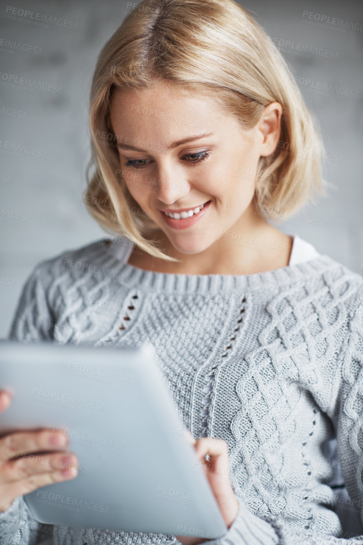 Buy stock photo Reading, tablet and smile with woman in home for streaming service, social media and subscription membership. Happy, network and movie account browsing with person online in living room of house