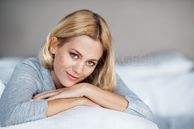 Buy stock photo A beautiful young woman resting her head on her couch indoors