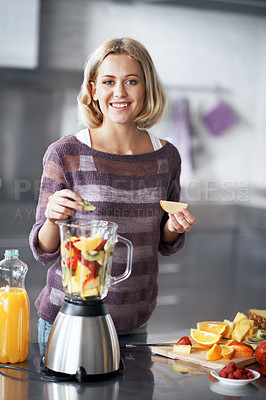 Buy stock photo A young woman with a homemade smoothie
