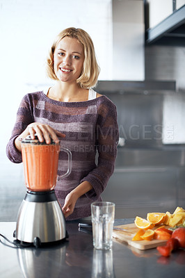Buy stock photo A young woman with a homemade smoothie