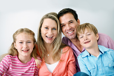 Buy stock photo Childcare, portrait and family in home with smile, child growth or bonding together on weekend break. Relax, parents or kids with love, happy moment or sibling connection in childhood development.