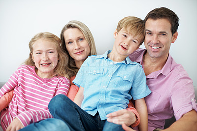 Buy stock photo Childcare, portrait and family in home with hug, child growth or bonding together on weekend break. Love, parents or kids with embrace, happy moment or sibling connection in childhood development.