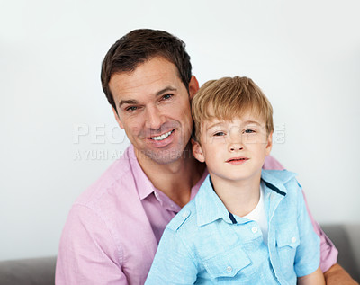 Buy stock photo Portrait, father and child in living room with smile, bonding together and relax on weekend break. Happy, man and son in house with family connection, wellness and support for childhood development.