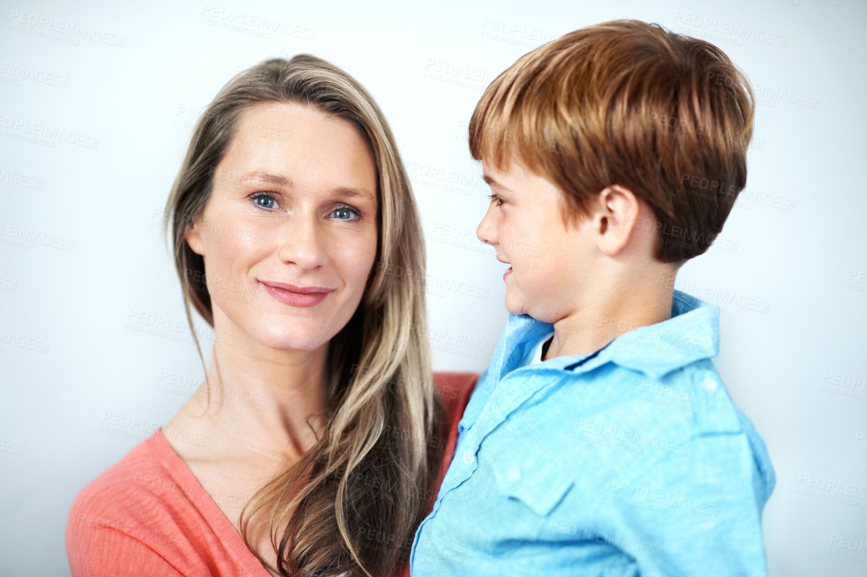 Buy stock photo Mother, relax and child in studio with smile, love and affection for bonding together. Portrait, woman and embrace with son for care, family connection and trust for weekend break on white background