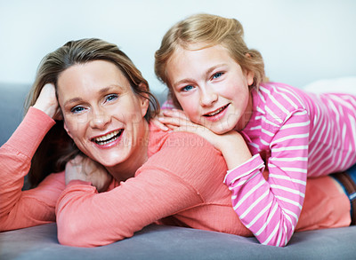 Buy stock photo Portrait, mother and child relax on couch with smile, support and bonding together on weekend break. Happy, woman and daughter rest in home with family wellness, connection and parent care for kid.