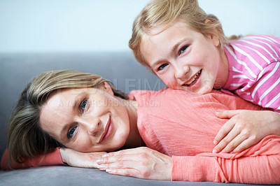 Buy stock photo Portrait, mother and happy on couch with child, love and affection for bonding together. Smile, woman and relax in lounge with daughter, family connection and comfortable for weekend break at house