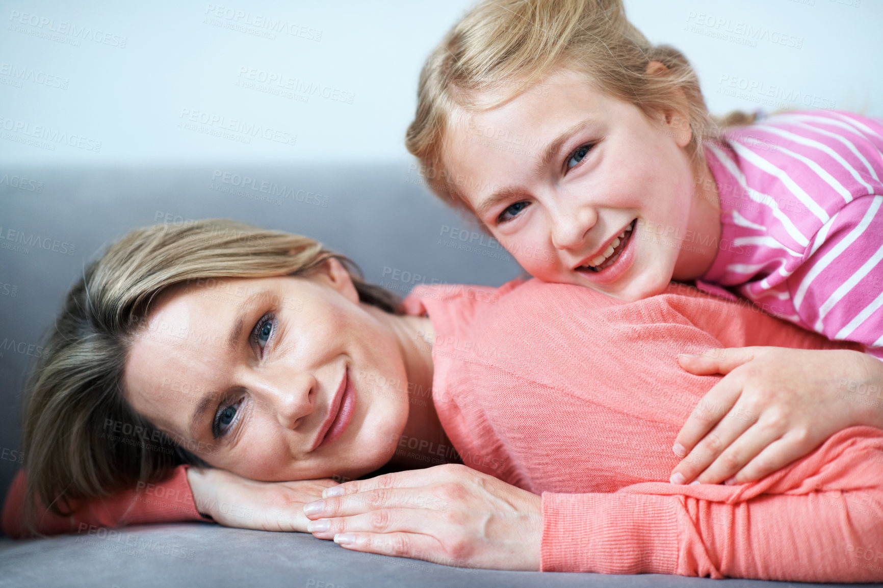 Buy stock photo Portrait, mother and happy on couch with child, love and affection for bonding together. Smile, woman and relax in lounge with daughter, family connection and comfortable for weekend break at house