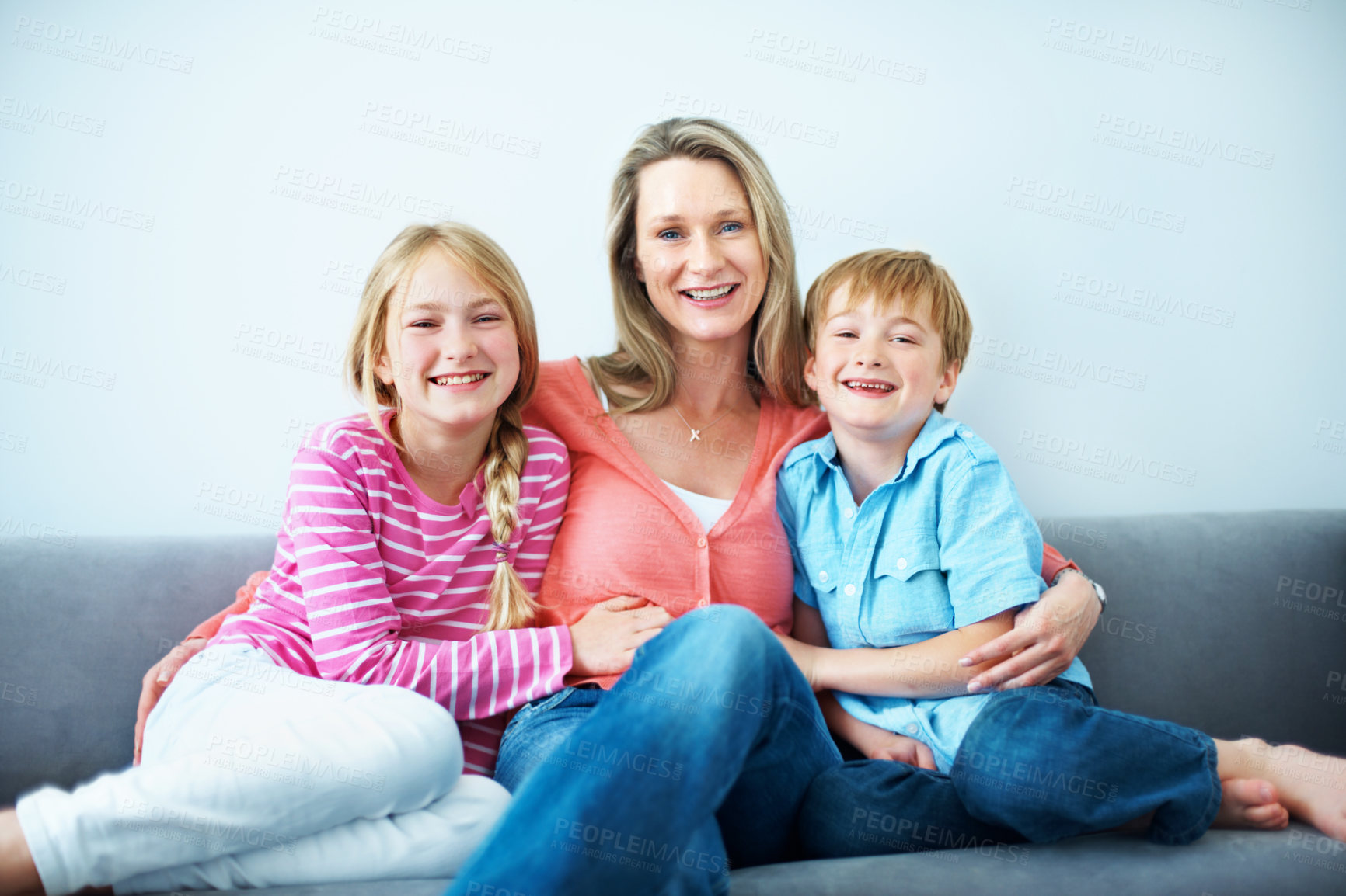 Buy stock photo Laughing, portrait and mom with children on sofa, love and family with smile on break or connection. Happy woman, home and affection for kids, childcare and single parent with pride in Australia