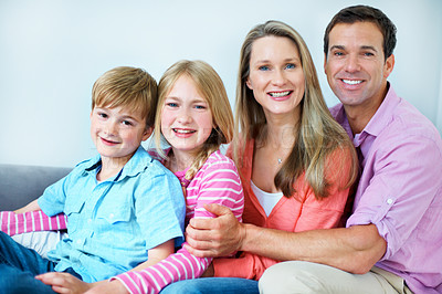 Buy stock photo Love, parents and kids in house with portrait, security or bonding together on weekend break. Support, children or family with embrace, happy moment or sibling connection in healthy relationship.