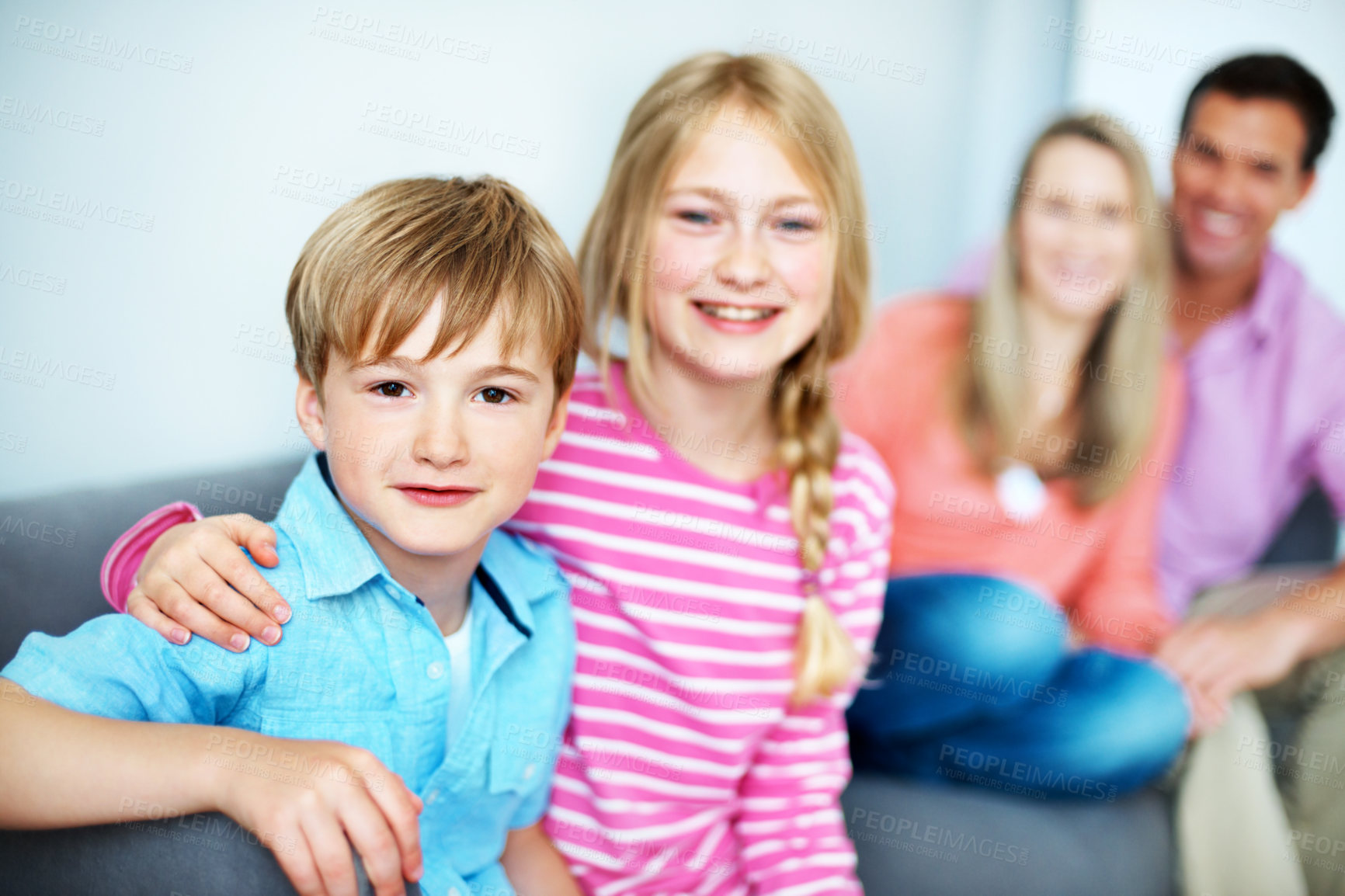Buy stock photo Portrait, boy and siblings at house with hug, love and affection for bonding together. Happy, children or embrace in living room with parents, family connection and weekend break for kids development