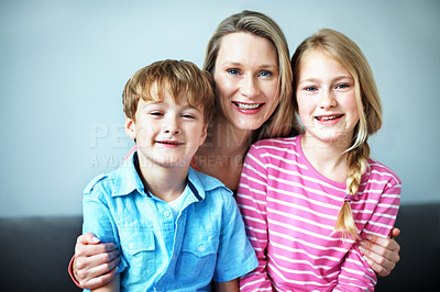 Buy stock photo Portrait, love and mom with children in lounge, family and bonding with smile on break or connection. Happy woman, home and affection for kids, childcare and single parent with pride in Australia