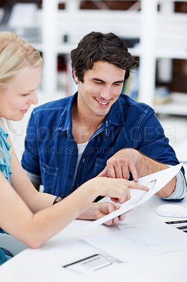 Buy stock photo Creative, meeting and people in office with documents, story draft or planning for magazine layout. Publishing, team and man with woman with paperwork for feedback, proofreading or advice for article