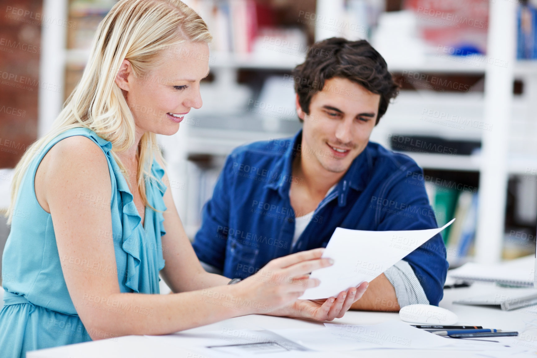 Buy stock photo Creative, office and business people with documents for meeting, strategy and planning at design agency. Startup, advertising and workers with paperwork for project, feedback and advice in workplace