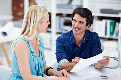 Buy stock photo Creative, talking and business people with documents for meeting, strategy and planning at design agency. Startup, advertising and workers with paperwork for project, feedback and advice in office