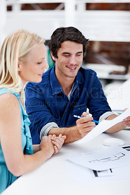 Buy stock photo Creative, office and business people with documents for discussion, strategy and planning at design agency. Startup, advertising and workers talking with paperwork for project, feedback and meeting