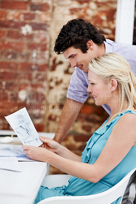 Buy stock photo Blueprint, discussion and team of architects in office with planning for building or construction project. Conversation, people and designers with paperwork for renovation or maintenance in workplace