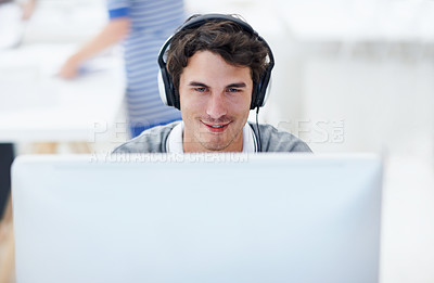 Buy stock photo Computer, headphones and businessman in office with research on software development with music. Happy, audio tech and male web designer listening to playlist for programming project in workplace.
