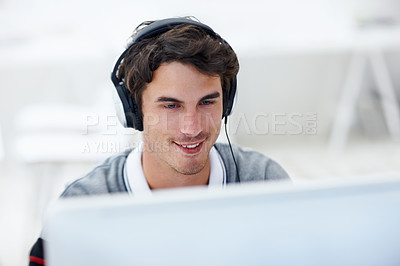 Buy stock photo Happy, headphones and businessman in office with research on software development with music. Computer, audio tech and male web designer listening to playlist for programming project in workplace.