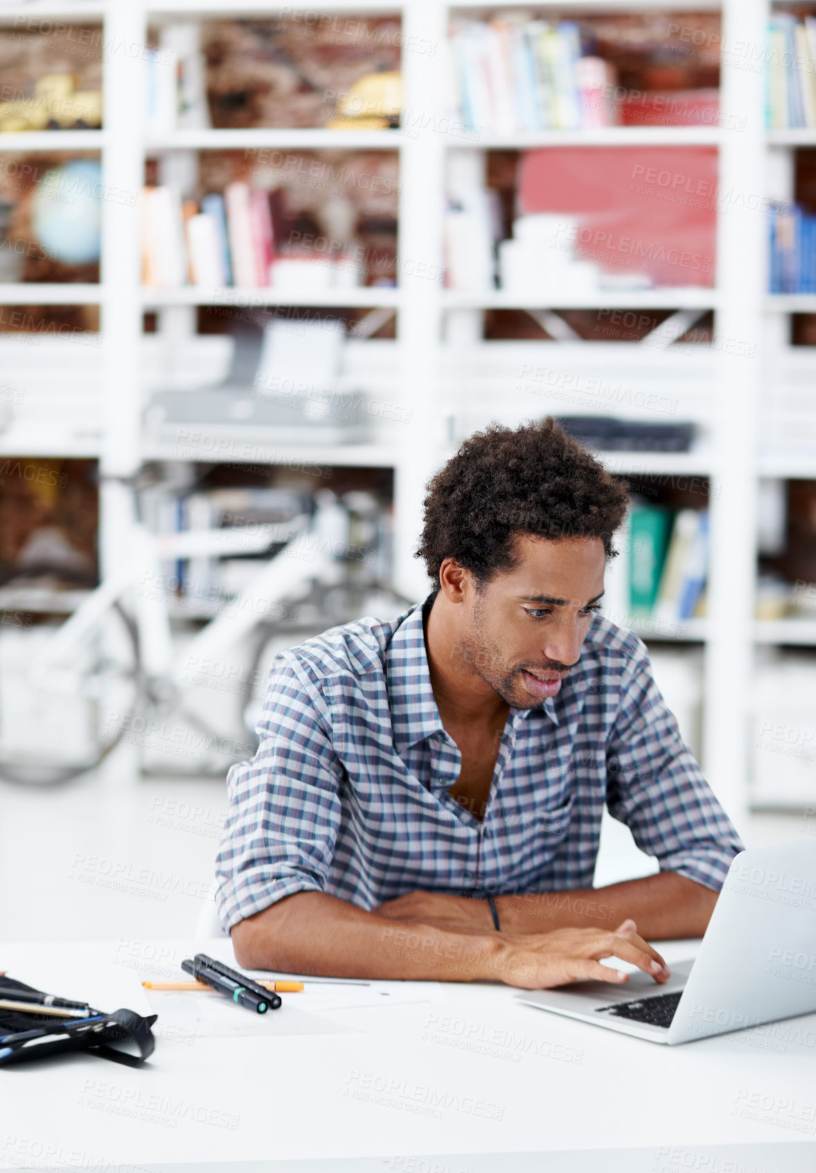 Buy stock photo Business, black man and typing in office with laptop, research and proofreading for copywriting. Male person, reading and workplace with tech, editing article and draft update for story submission