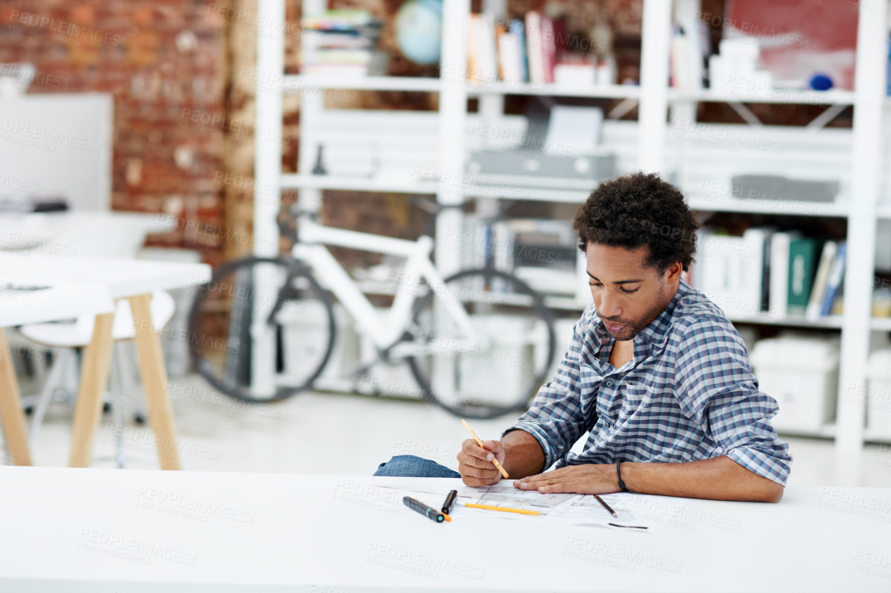 Buy stock photo Architect, man and planning with blueprint in office for construction or building design. Male person, property designer or civil engineer with documents, layout or paperwork for architecture project