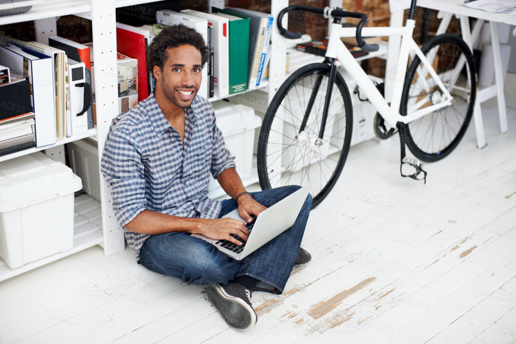 Buy stock photo Laptop, portrait and businessman with bicycle in office for copywriting, online article and story draft. Creative, startup and African person on computer for research, website and report with bike