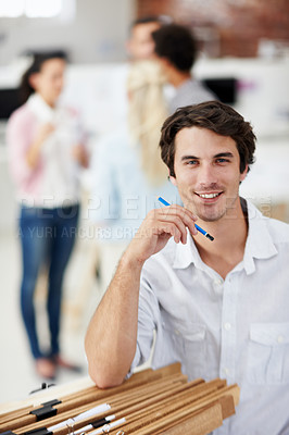 Buy stock photo Creative, portrait and man with smile in office, confident or ambition for design career development. Interior designer, skills and happy person with pencil, pride and artistic project in business
