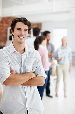 Buy stock photo Creative, man or happy with arms crossed in office for editorial expertise, career pride or about us. Staff, editor or portrait at agency for news reporting, publishing industry or editing confidence