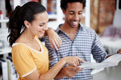 Buy stock photo Creative, people and planning in office with magazine, review copywriting work and smile for teamwork. Happy, coworkers and copywriter check article for media publication, collaboration and feedback.