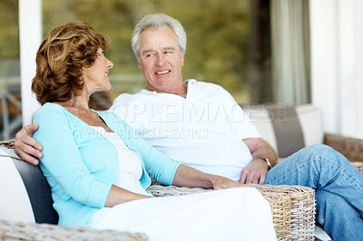 Buy stock photo Happy, conversation and senior couple in backyard with bonding, connection or communication. Smile, marriage and elderly man with woman outdoor at home for love, care and relax in retirement together